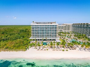 A multi-story hotel with a pool area and beach access. - Cancun All-Inclusive, Adults Only, Ocean Front Luxury Resort (Cancún)