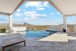 A rooftop pool with a view of a mountain and a clear sky. - The Watch Tower | Infinity Pool & Panoramic Views (Fountain Hills)