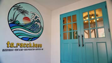 A wall with a logo and text for 'to_racckbase' featuring a wave graphic.