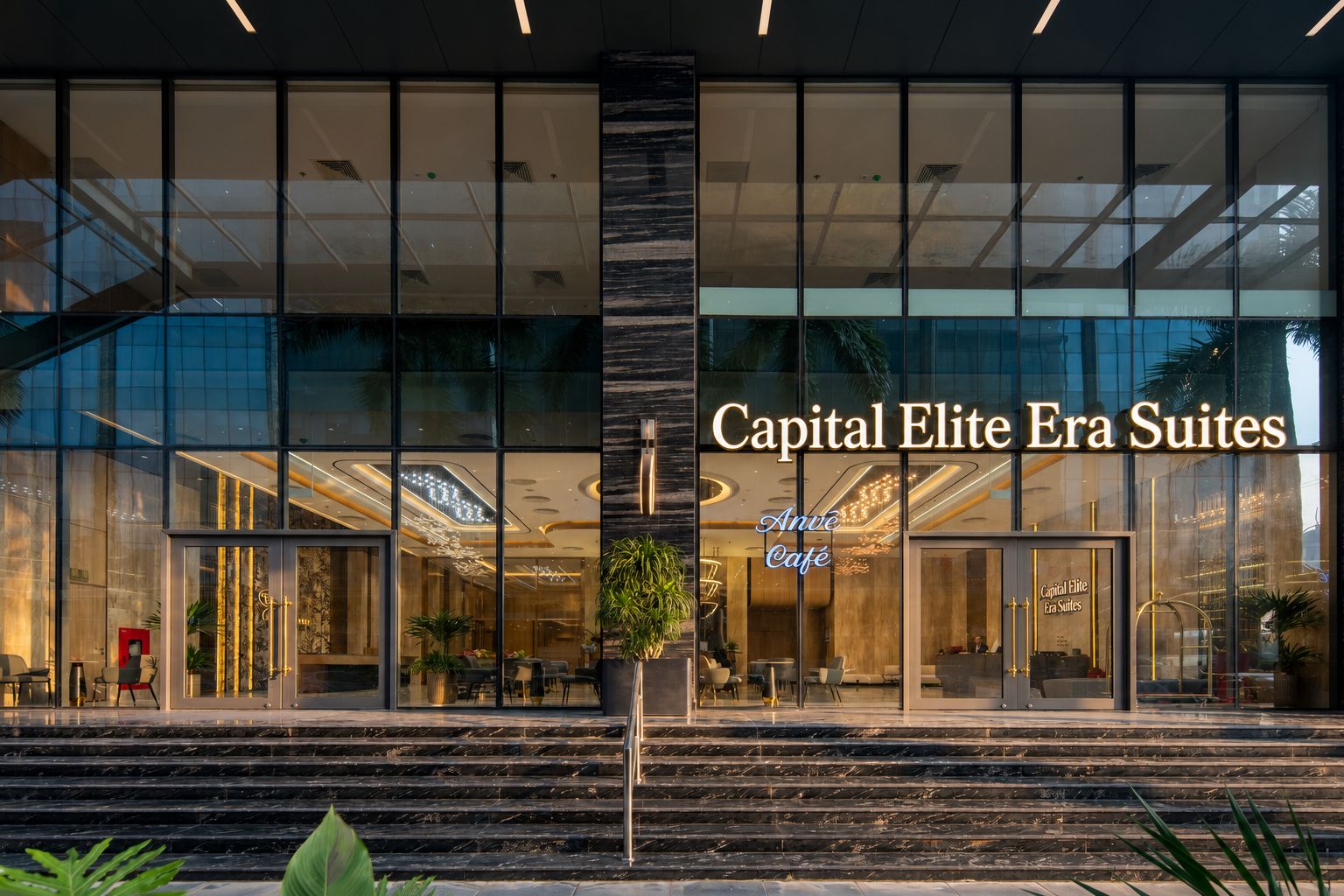 Exterior del hotel Capital Elite Era Suites, con fachada de vidrio, una zona de café y una escalera que lleva a la entrada.