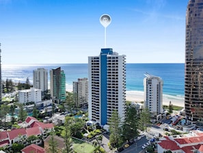 A high-rise hotel with a view of the beach, surrounded by other buildings and greenery. - Longbeach 204 - 1 Bedroom Superior (Surfers Paradise)
