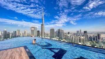 Outdoor pool, open 7:00 AM to 7:00 PM, pool umbrellas, pool loungers