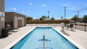 A rectangular swimming pool with a diving board, surrounded by a fence, and a building with a 'No Diving' sign. - 1 King Bed|Hearing Accessible,Kitchen (Corpus Christi TX)
