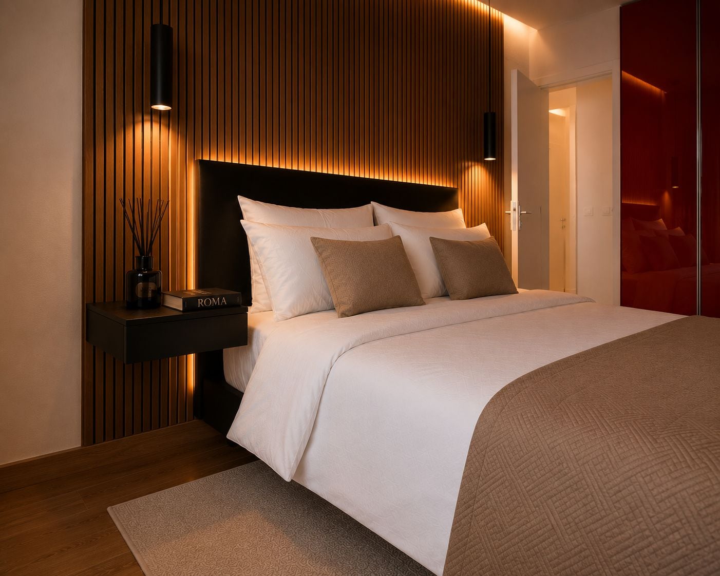 A modern bedroom with a bed, bedside tables, and a wall-mounted light fixture.