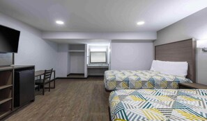 A hotel room with a bed, a desk, a chair, a television, and a wardrobe. - 2 Queen Beds|Non-Smoking,Micfridge (Hickory)