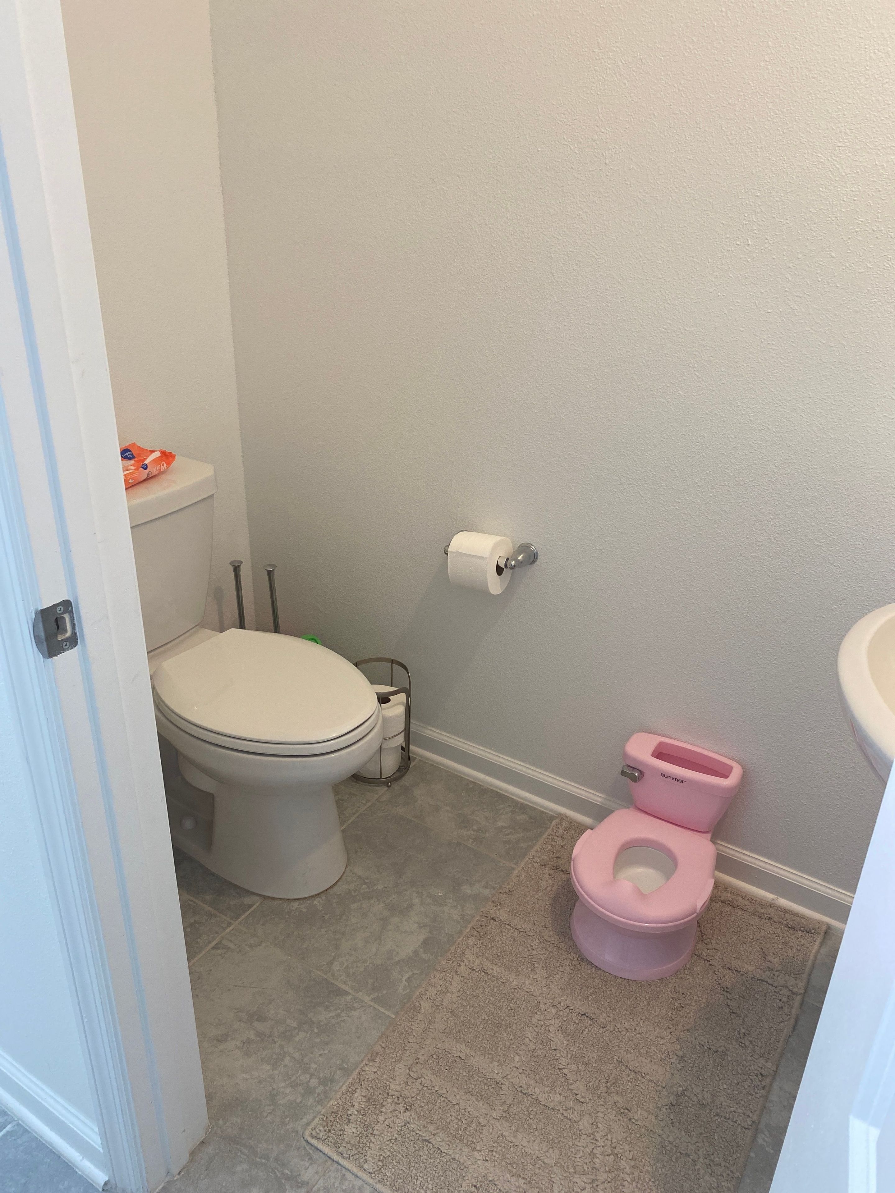A bathroom with a toilet, bidet, and a shower area.