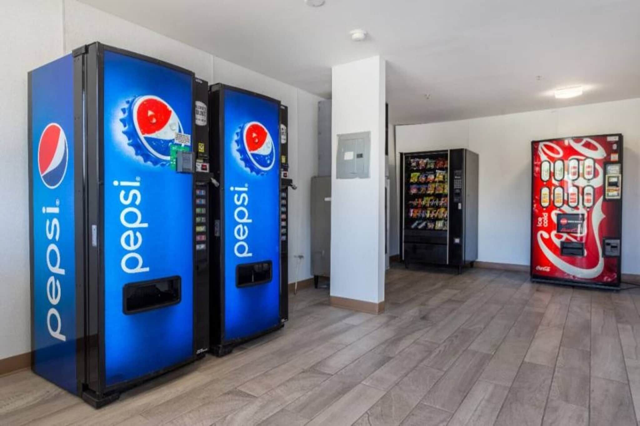 Vending machines with Pepsi branding in a hallway.