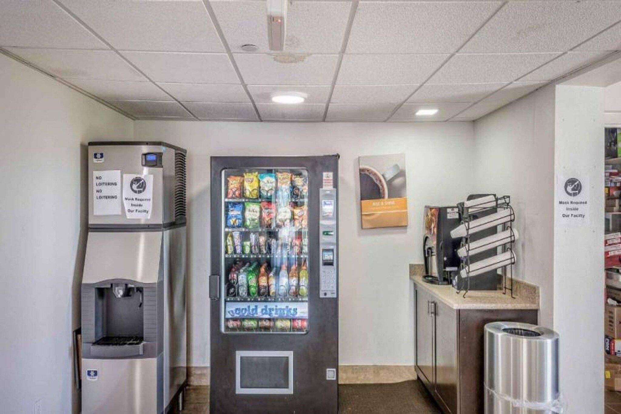 A vending machine with a variety of snacks and a water dispenser.