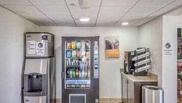 A vending machine with a variety of snacks and a water dispenser.