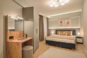 A modern bedroom with a bed, bedside tables, a desk, a mirror, and a ceiling light fixture. - Fischer, 2BR, Bright, Stylish (Kadıköy)