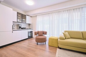 A modern apartment with a kitchen, a dining area, and a living room. - Arcturus, 2BR, Best Loc (Kadıköy)