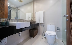A modern bathroom with a black sink, a glass shower enclosure, and a white toilet. - Apartment with Sea View and Hot Tub on Balcony (Rawai)