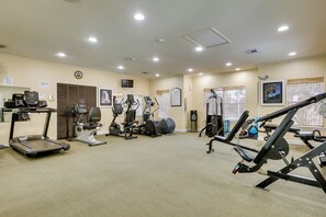 A fitness center with treadmills, elliptical machines, and weight equipment. - Venetian Palms Condo: Pool, Hot Tub & Tennis! (Fort Myers)