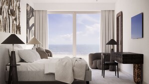 Un dormitorio moderno con un gran ventanal, una cama, una silla y un escritorio.