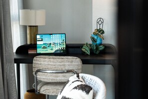 A room with a desk, a laptop, a chair, and a decorative plant. - StayCentral - The Islington - Islington Street, Collingwood - 1 Bedrooms, 1 Bed, 1 Bath, 1 secure undercover parking (stacker - induction required). (Collingwood)