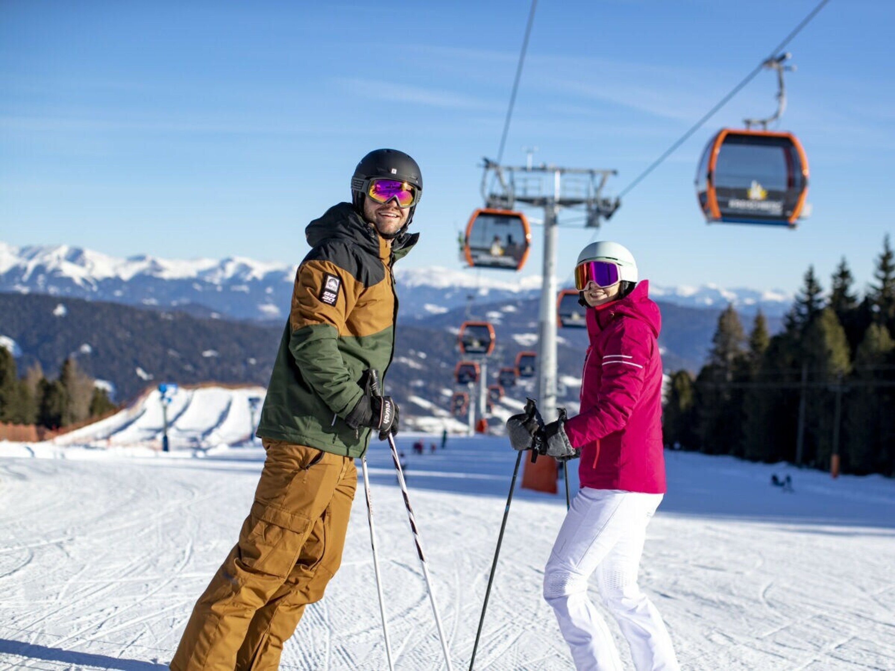 A ski slope with a chairlift in the background and a clear sky.