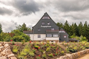 A two-story building with a steeply pitched roof, labeled 'Zugspitze.'