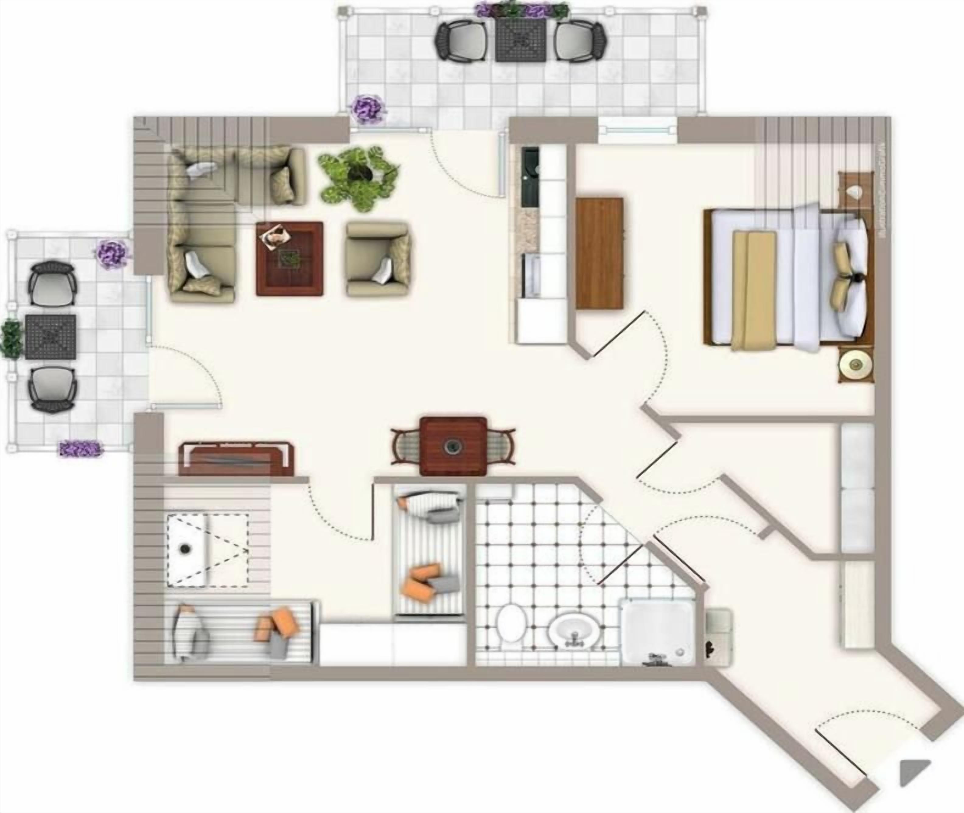 Ein Hotelzimmer mit Bett, Sitzecke, Küchenzeile und Badezimmer.