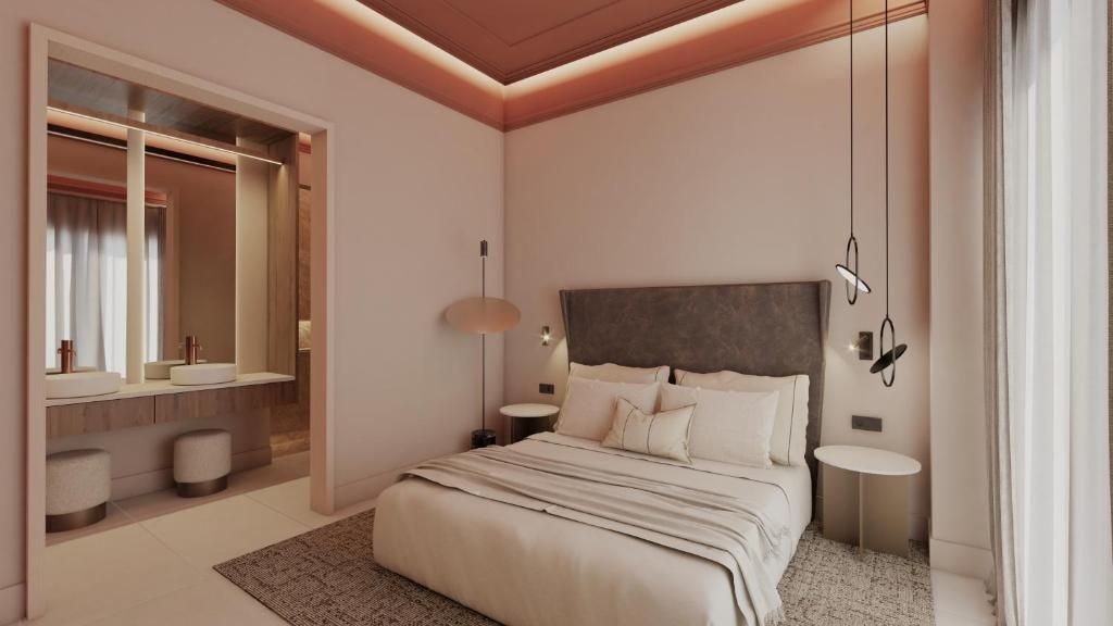 Un dormitorio moderno con una cama grande, mesitas de noche, un espejo y un armario.