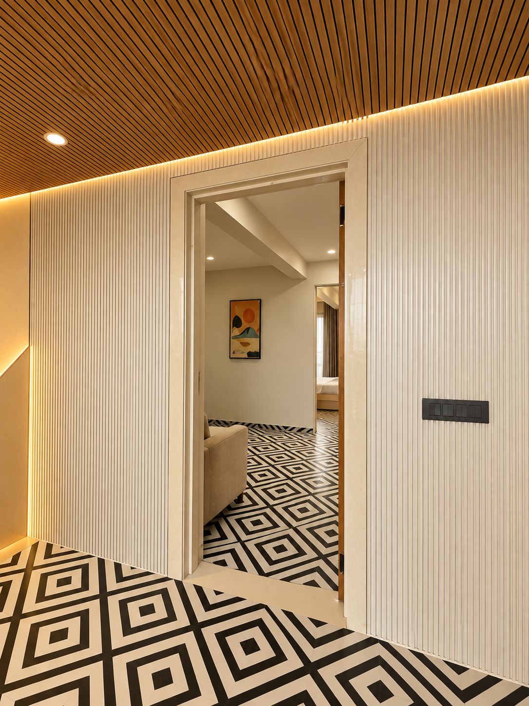 A hallway with a geometric patterned floor, a wooden ceiling, and a door leading to a room with a bed.