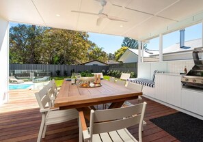 Bellaburra | Enjoy a BBQ under the covered entertaining deck | Ceiling fan | Bar fridge | Lounge area | Outdoor furniture | Enclosed yard | Pets welcome - Bellaburra – relaxed family beach house near Callala Beach (Callala Beach)