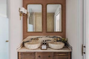 A bathroom with two sinks, a mirror, and a vanity with drawers. - Casa Alameda 1760 Member Of Melia Collection (Cadiz)