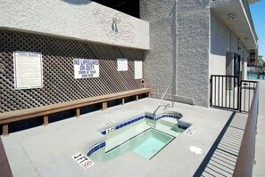 A pool area with signs indicating no lifeguard on duty and swim at your own risk. - 3-bedroom, 2-bathroom, oceanfront condo, Plenty of updates and upgrades | Sea Castle - 3D (North Myrtle Beach)