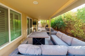 An outdoor patio with a dining table, seating, and a grill. - 5 Mi to Hospital! Chandler Extended Stay (Chandler)