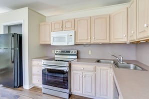A kitchen with a stainless steel refrigerator, a microwave, an oven, and a sink. - On-site Ponds! Peaceful Franklin Studio (Franklin)