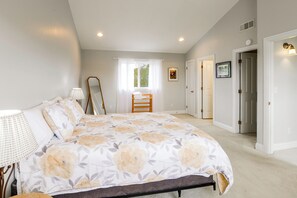 A bedroom with a bed, a chair, a window, and a door. - 2 Mi to Ocean & Coastal Trails! Mckinleyville Home (McKinleyville)