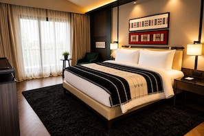 A hotel room with a large bed, a desk, a chair, and a window with curtains. - Polo Hotel Kohima (Kohima)