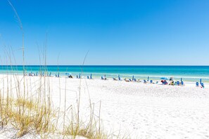 A beach with clear skies, white sand, and a calm sea. - Mainsail 352 3 Bedroom Condo (Miramar Beach)