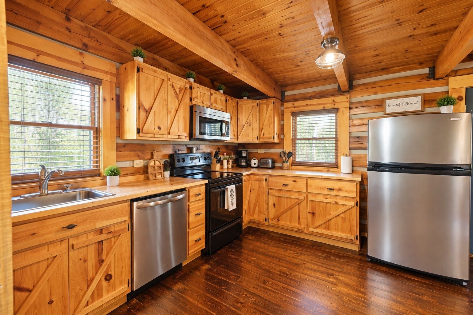 A kitchen with wooden cabinets, stainless steel appliances, and a wooden ceiling.
