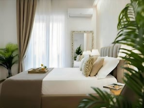 Deluxe Room, Multiple Beds, Private Bathroom, Garden View | In-room safe, desk, laptop workspace, soundproofing - Porta Normanna Charming Rooms (Palermo)