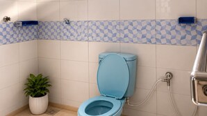 A bathroom with a toilet, a shower, a window, and a potted plant. - Adorable 4-bedroom bungalow in terrific Taita Taveta location (Taita Taveta)