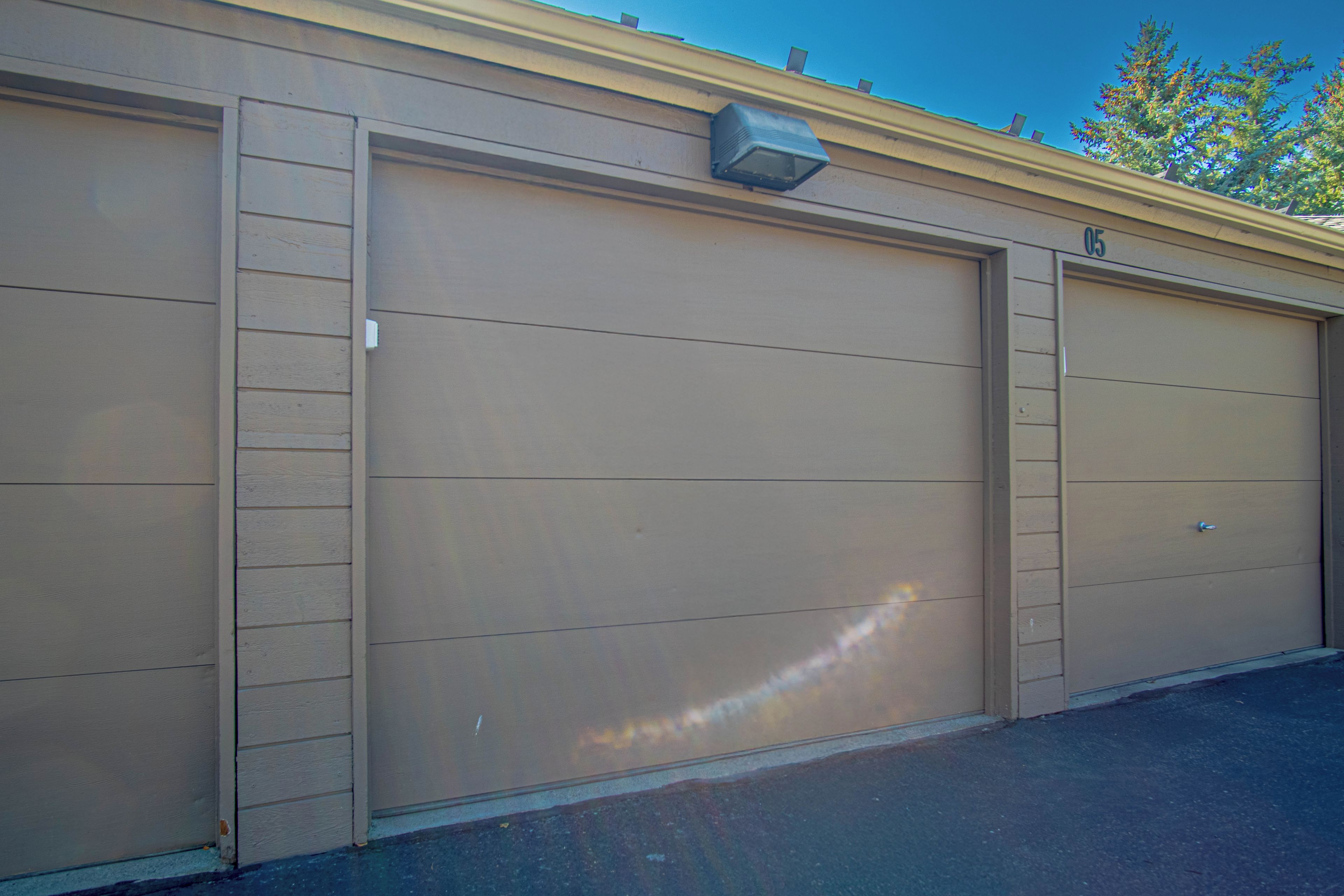 A two-car garage with a light fixture above the left door.
