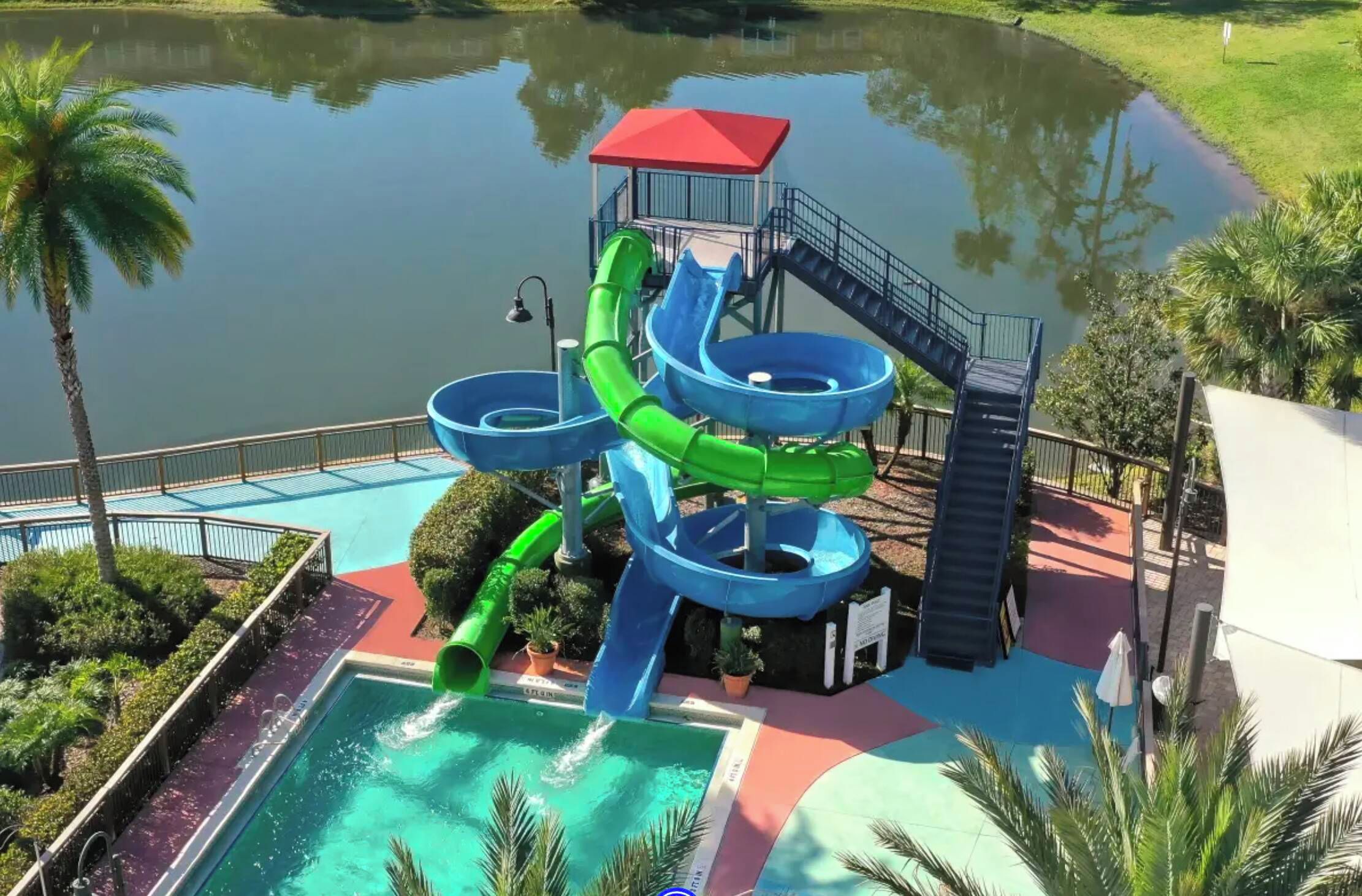 A water park with multiple slides and a pool area.