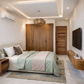 A modern bedroom with a bed, nightstand, TV, and wardrobe. - Modern & Luxury Apartment - (Izdihar) Marrakech (Marrakech)