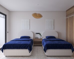 Ein modernes Schlafzimmer mit zwei Betten, einem Nachttisch und einer Hängeleuchte.