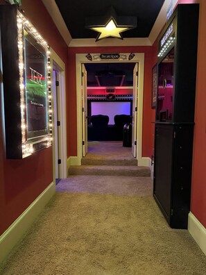 A theater room with a star ceiling, a sign reading 'Theatre Room,' and a 'Box Office' sign on the right. - Secluded Lake Norman Waterfront Luxury, 4BR, 5.5 Baths with Home Theater (Mooresville)