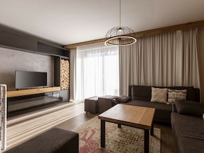 A modern living room with a flat-screen TV, a sofa, a coffee table, and a fireplace. - Apartment in Rohrmoos-untertal With Sauna (Schladming)