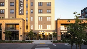 A multi-story building with a prominent 'ALBA' sign at the entrance. - Inviting 1BR at Alba with Pool (Santa Clara)
