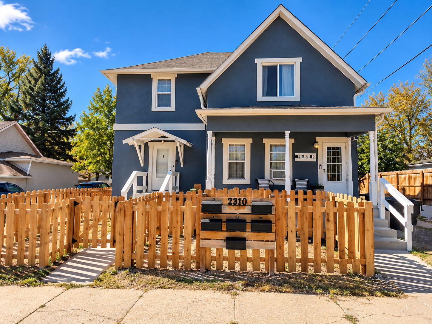 Sunny Blue-Gray Duplex with Mailboxes