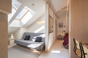 A modern bedroom with a loft bed, skylights, and a walk-in closet. - Brand-New Scandi Attic Loft | 5 Separate Beds (Riga)
