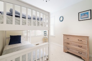 A child's bunk bed with a small dresser and a framed picture on the wall. - Golf Views, Private Pool/Spa, Community Amenities! (Corolla)