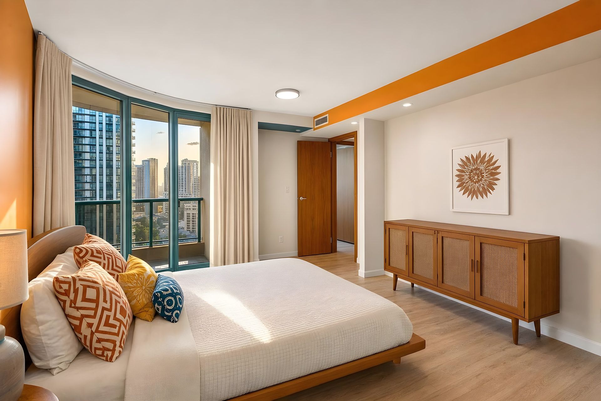 Une chambre avec un grand lit, une armoire en bois et une vue sur la ville par la fenêtre.