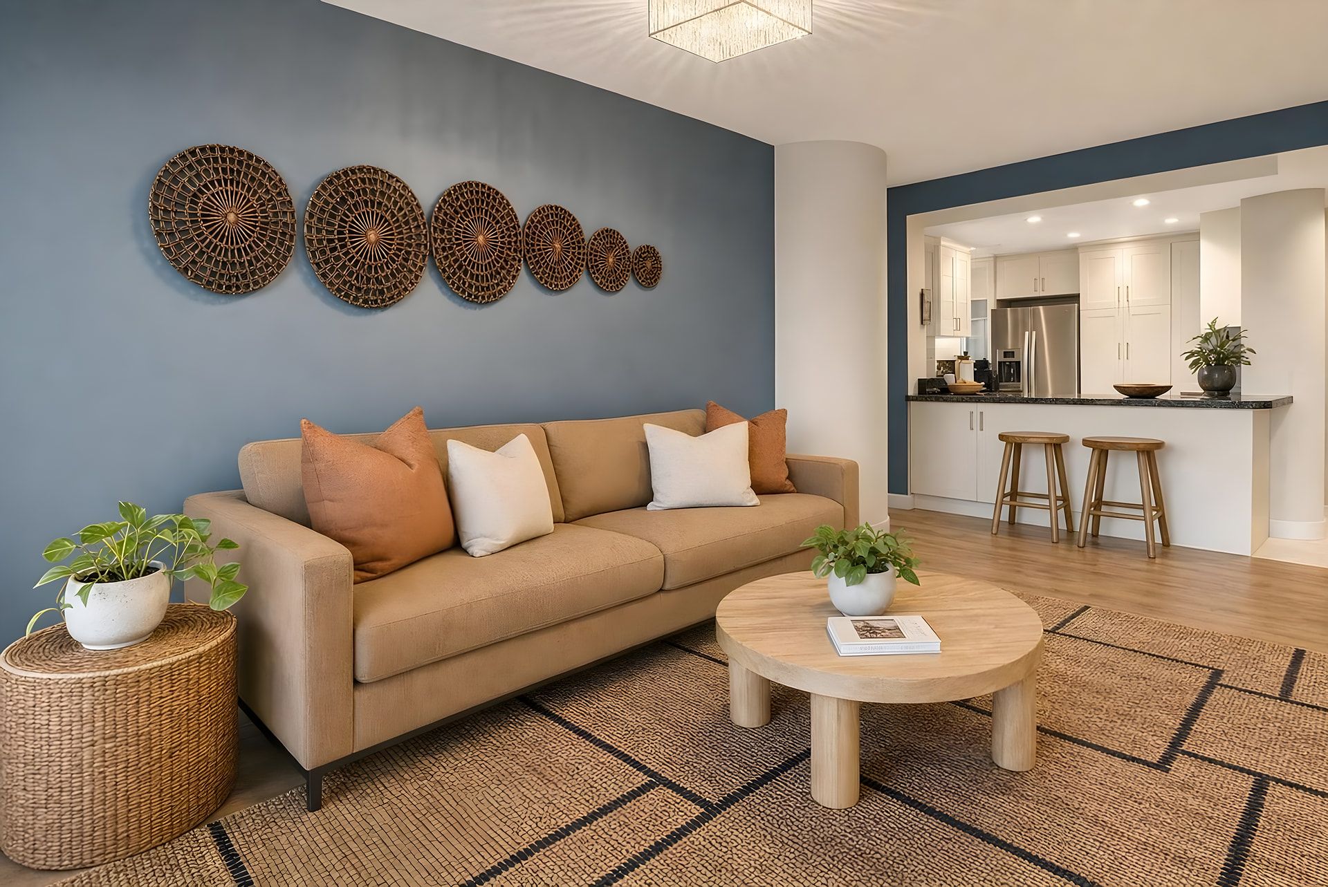 A modern living room with a sofa, coffee table, and decorative wall art.