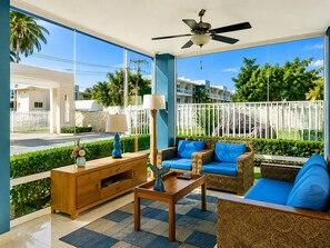A room with a ceiling fan, a sofa set, a wooden side table, and a lamp. - Walk to Beach! Modern Luxury & Peace in Cortecito (Punta Cana)