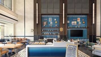 A modern bar area with a counter, seating, and a large screen.