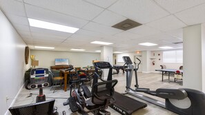A fitness center with treadmills, stationary bikes, and a rowing machine. - Oceanfront Crescent Beach • 3 King Beds • Private Terrace • Pool (Saint Augustine)